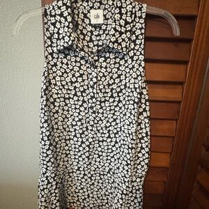 CAbi Black and White Buttoned Notched Collar Blouse w/cute peplum hem!
